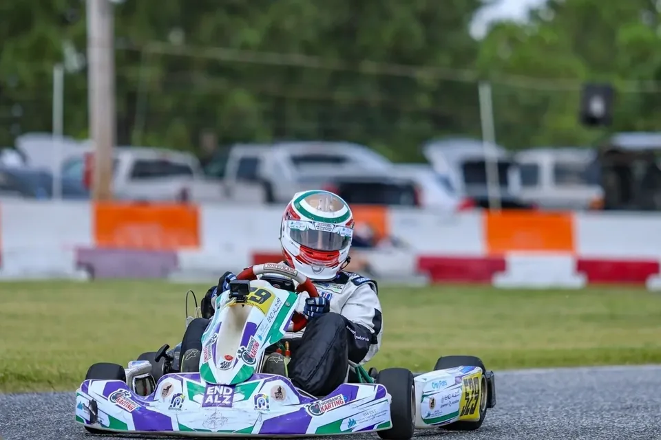 End Alzheimer's Motorsports driver racing a kart