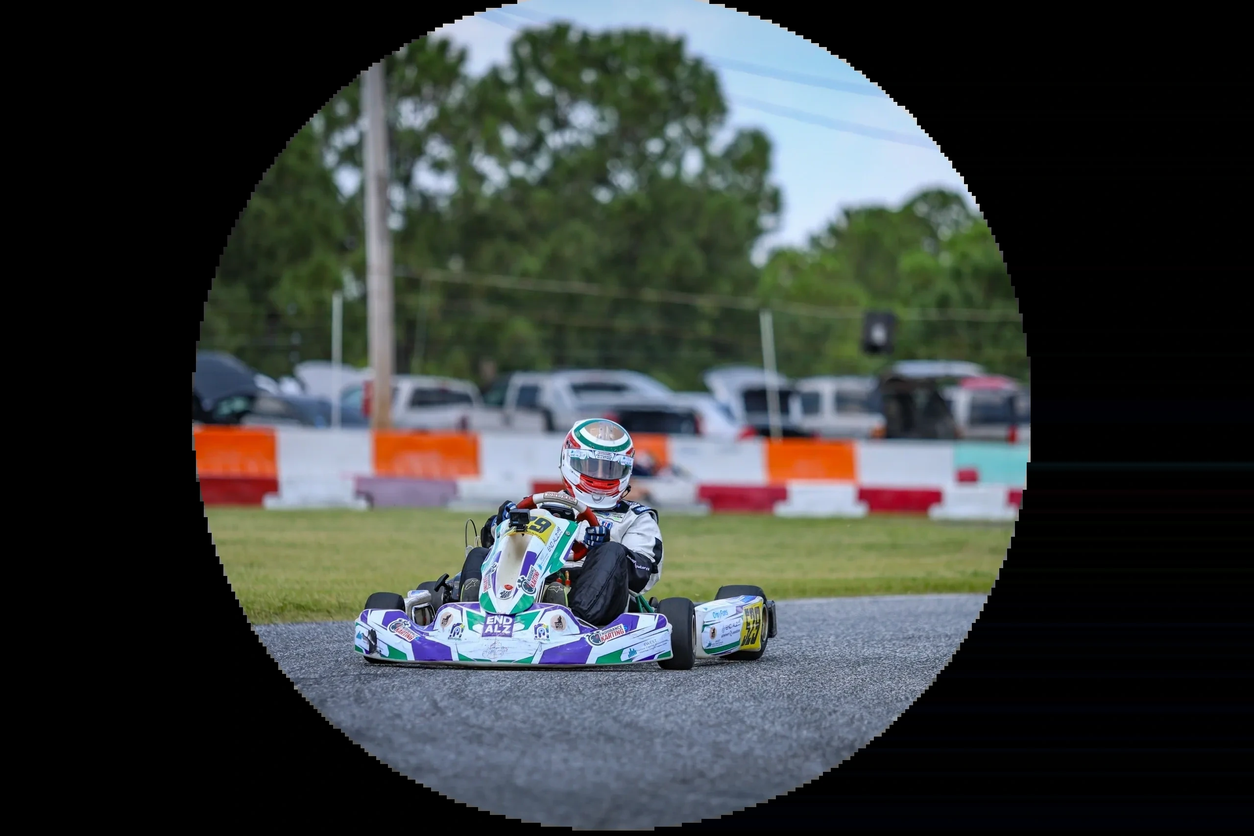 End Alzheimer's Motorsports driver racing a kart, in the original circular photo artwork